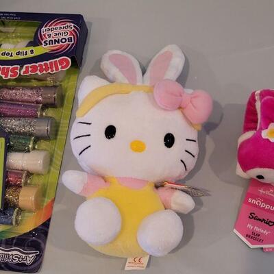 Lot 386: New Easter Basket with Dress Up Butterfly Wings, HELLO KITTY Slap Bracelet & Ty Beanie Baby Glitter Craft, Pop On Nails,...