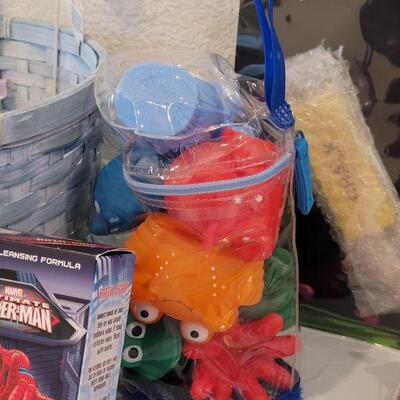 Lot 387: New Easter Basket with Ganz Bunny, Bath Toys, Spider-Man Bath Soap-Shampoo-Cleansing Gel, Pez, Activity Pad