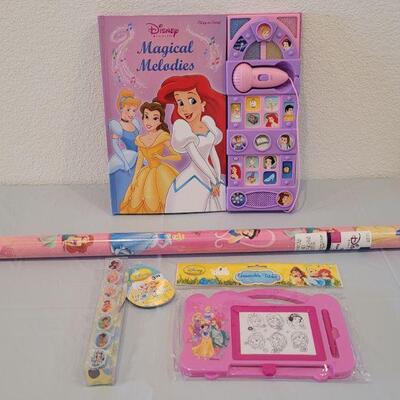 Lot 390: New Disney Princess Singing Book, Lip Gloss Rings, Erasable Tablet and Wrapping Paper 