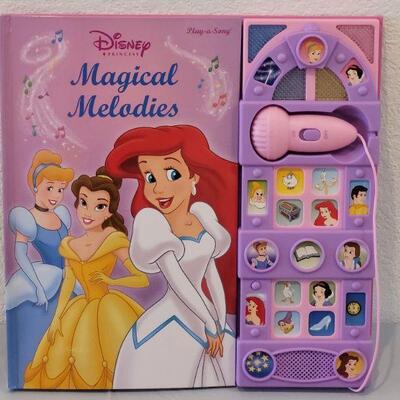 Lot 390: New Disney Princess Singing Book, Lip Gloss Rings, Erasable Tablet and Wrapping Paper 