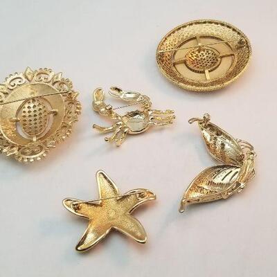 Lot #35  Lot of 5 Brooches - one Swarovski