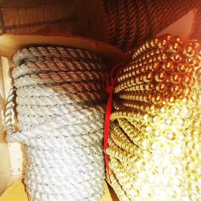 Box of Upholstery trim and bead yardage on bolts