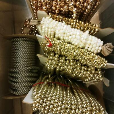 Box of Upholstery trim and bead yardage on bolts