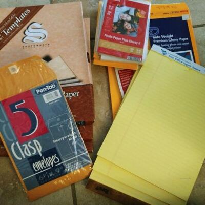 Box of office paper, envelopes, adding machine