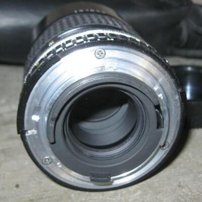 Lot 78 Nikon 35mm Camera EM + Extra Lens Series E1:28