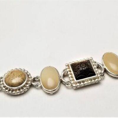 Lot #114  Sterling Silver (marked ) Bracelet set with Neutral colored stones