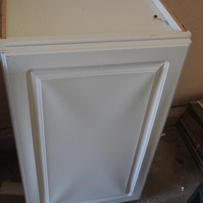 2 white storage cabinets