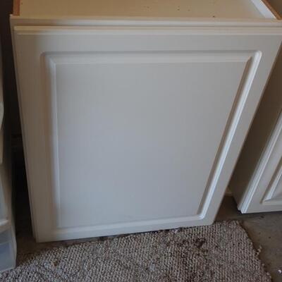 2 white storage cabinets