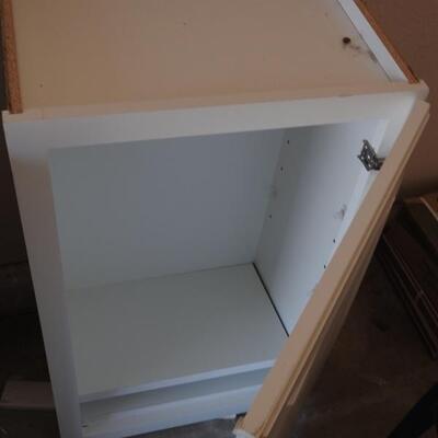 2 white storage cabinets