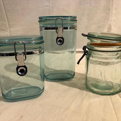 3 green storage containers