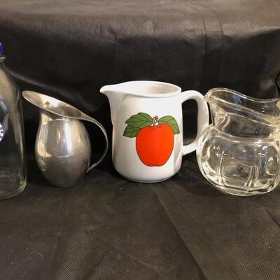 3 pitchers and a milk bottle