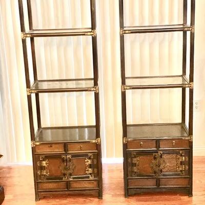 Two tall Asian style book shelves with cabinet 