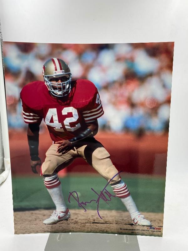 Autographed Ronnie Lott Football Photo.