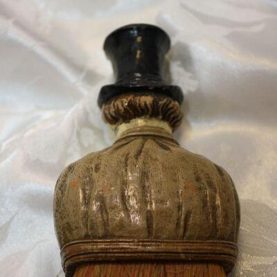 Creepy Dickens style figural crumb whisk broom