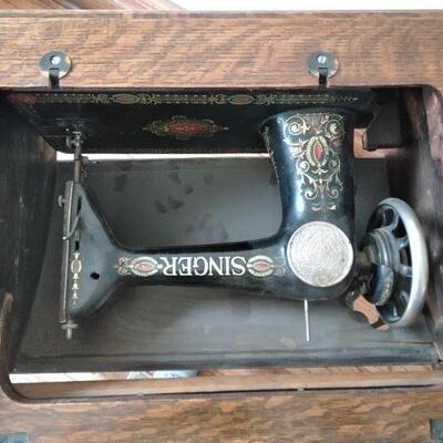 LOT 8  ANTIQUE SINGER TREADLE SEWING MACHINE IN CABINET