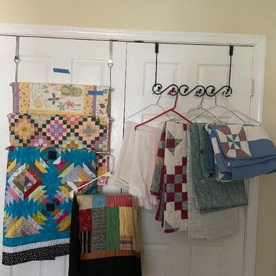 Lot 38 - 7 handmade quilts, table cloths, misc. blankets