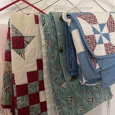 Lot 38 - 7 handmade quilts, table cloths, misc. blankets