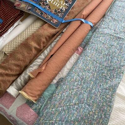 Lot 42 - Rolls of fabric , quilting books, quilt