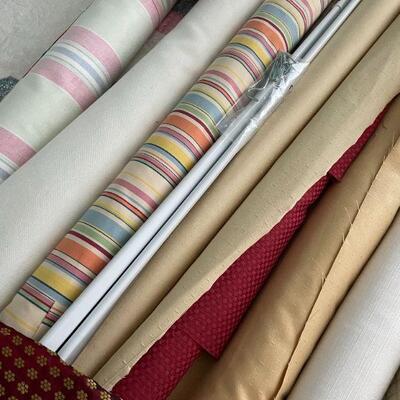 Lot 42 - Rolls of fabric , quilting books, quilt