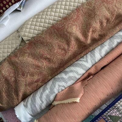 Lot 42 - Rolls of fabric , quilting books, quilt