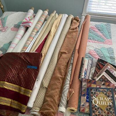 Lot 42 - Rolls of fabric , quilting books, quilt