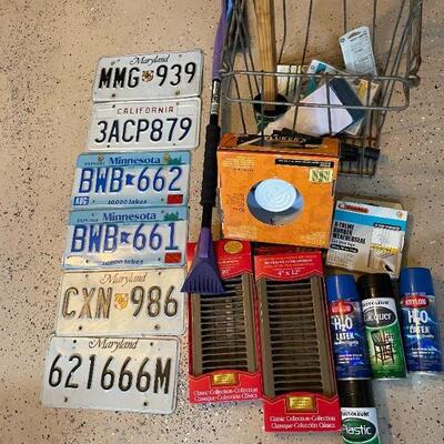 Lot 55 -  (6) vintage license plates, metal basket, level, misc. sprays and supplies
