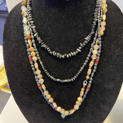 Lot 74 - (3) hematite necklaces, one pair of hematite earrings, (2) hematite bracelets, (2) natural stone necklaces, one natural stone...