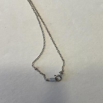 Lot 83 - 14kt white gold necklace with scrimshaw pendant