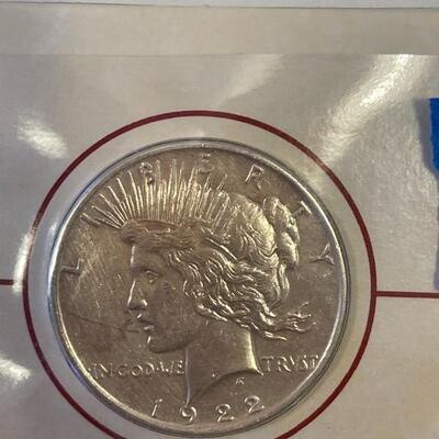 Lot 87 - 1922 peace dollar with Alexander Graham Bell stamp, 1923 Calvin Coolidge becomes president stamp, 1923 peace dollar President...