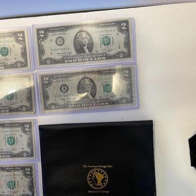 Lot 95 - lot of (4) $1 bills, lot of (7) $2 dollar bills, American heritage mint historic US coinage Washingtonâ€™s last year silver coin...