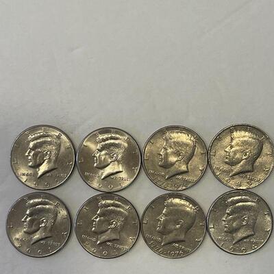 Lot 98 - Lot of (8) Kennedy half dollars