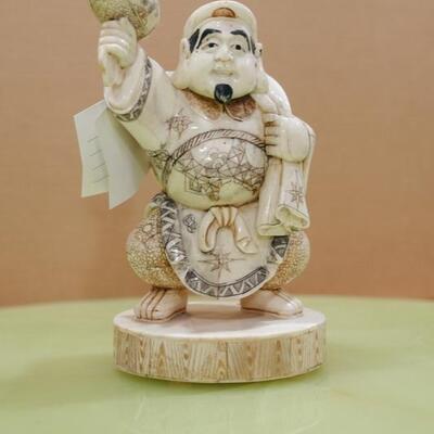 Bone Sculpture -Chinese man holding mallet 