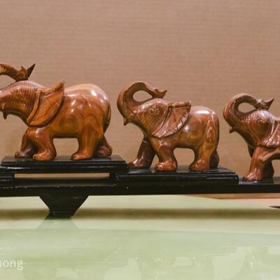 Parade of Brown Marble Elephants