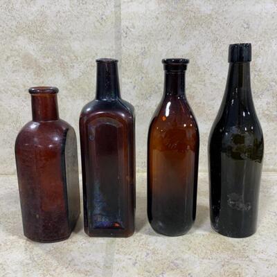-126- VINTAGE | Four Brown/Amber Glass Bottles | Paineâ€™s