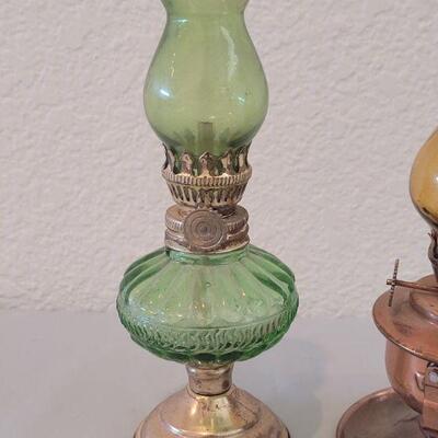 Lot 75: Small Oil Lamps - Brass with Green Glass & Copper with Amber Glass