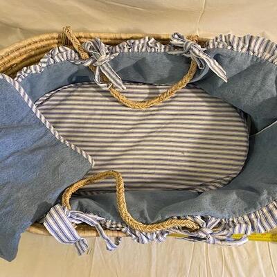 Rattan baby bassinet with denim and flannel bumpers and blanket 