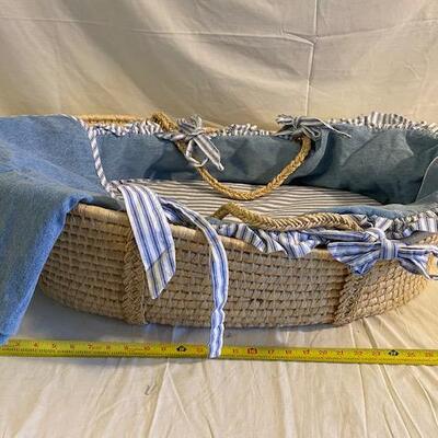 Rattan baby bassinet with denim and flannel bumpers and blanket 