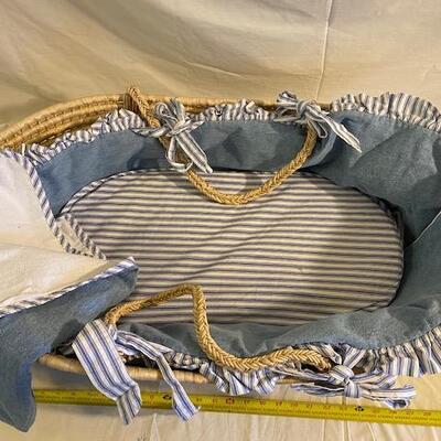 Rattan baby bassinet with denim and flannel bumpers and blanket 
