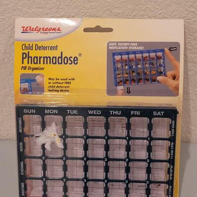 Lot 103: (3) Pop Open Caddies and a Pharmadose Pill Box