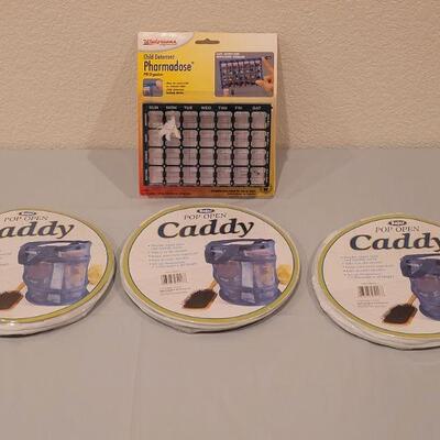 Lot 103: (3) Pop Open Caddies and a Pharmadose Pill Box