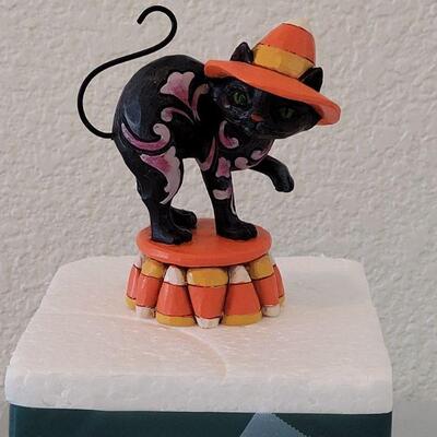 Lot 129: Jim Shores Candy Corn Black Cat (has Styrofoam package but not the box)