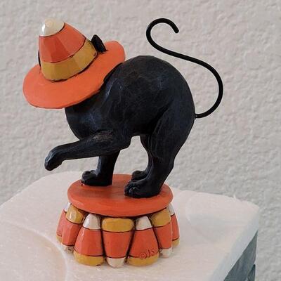 Lot 129: Jim Shores Candy Corn Black Cat (has Styrofoam package but not the box)