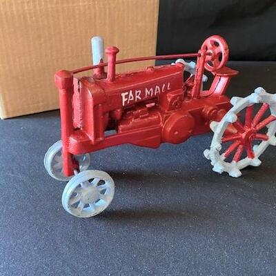 LOT#G299: Farmall Cast Tractor NOS