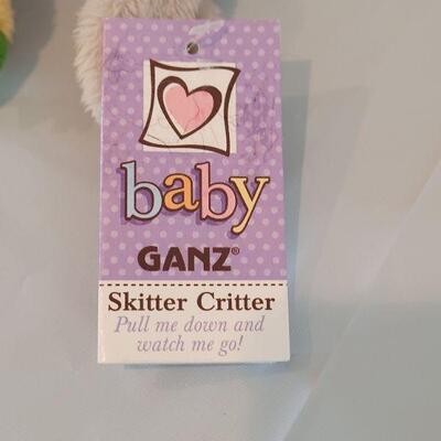 Lot 78: Baby Girl Talking Album, Book, Ganz Skitter Critter, Picture Frame, Bib and Hat