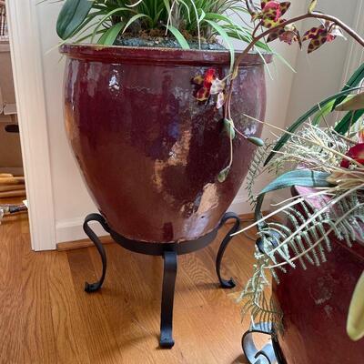 Lot 49 - Two Red Planters with Faux Floral & Metal Stands