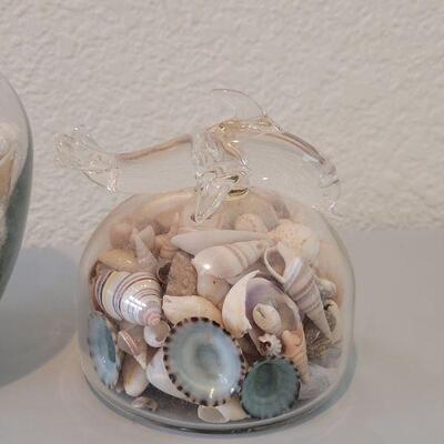 Lot 116: Glass Containers with Sand and Shells from different beaches 