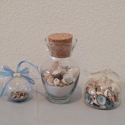 Lot 116: Glass Containers with Sand and Shells from different beaches 