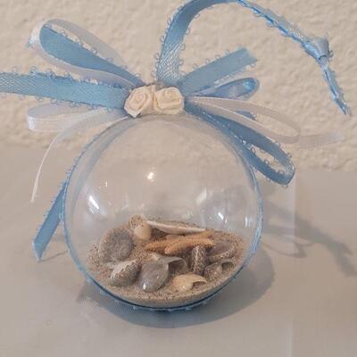 Lot 116: Glass Containers with Sand and Shells from different beaches 