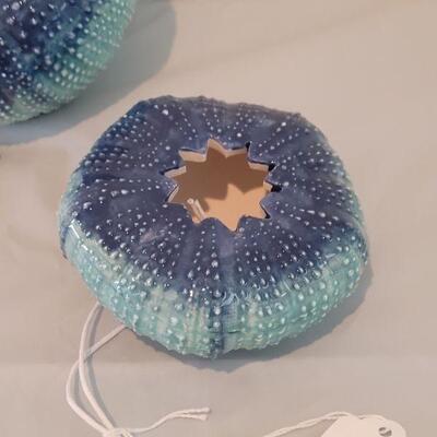 Lot 117: (2) New Sea Urchin Air Plant Holders and Maui Dolphin Candle holder 