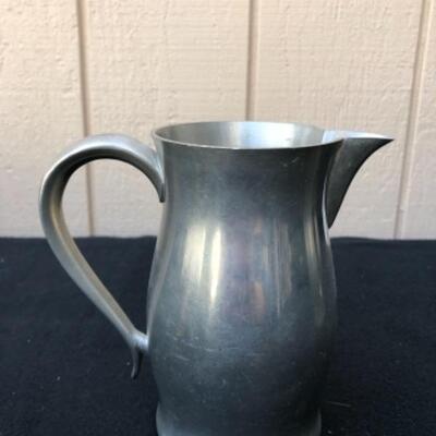 Lot 33P. 4 Pewter pitchers in various sizes â€” $37.50